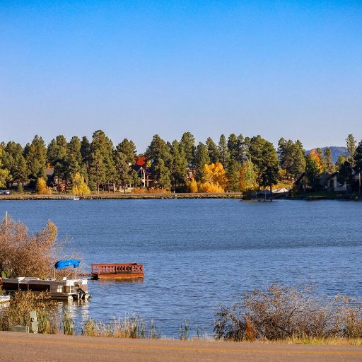 View from Parking Area of Condo - Public lake access permitted down the road.  Home does NOT have private access. 